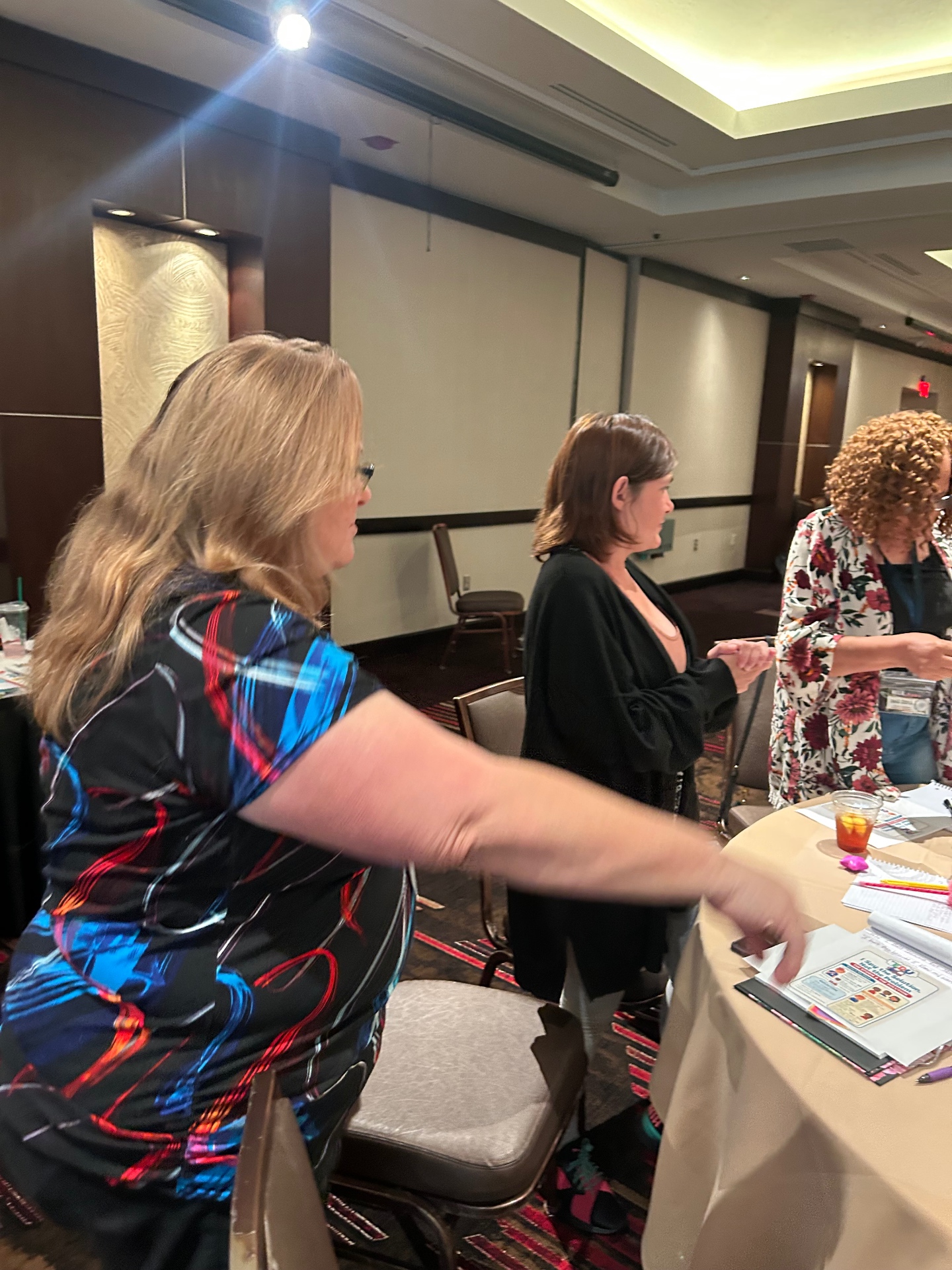 Staff networking and sharing ideas at a professional conference