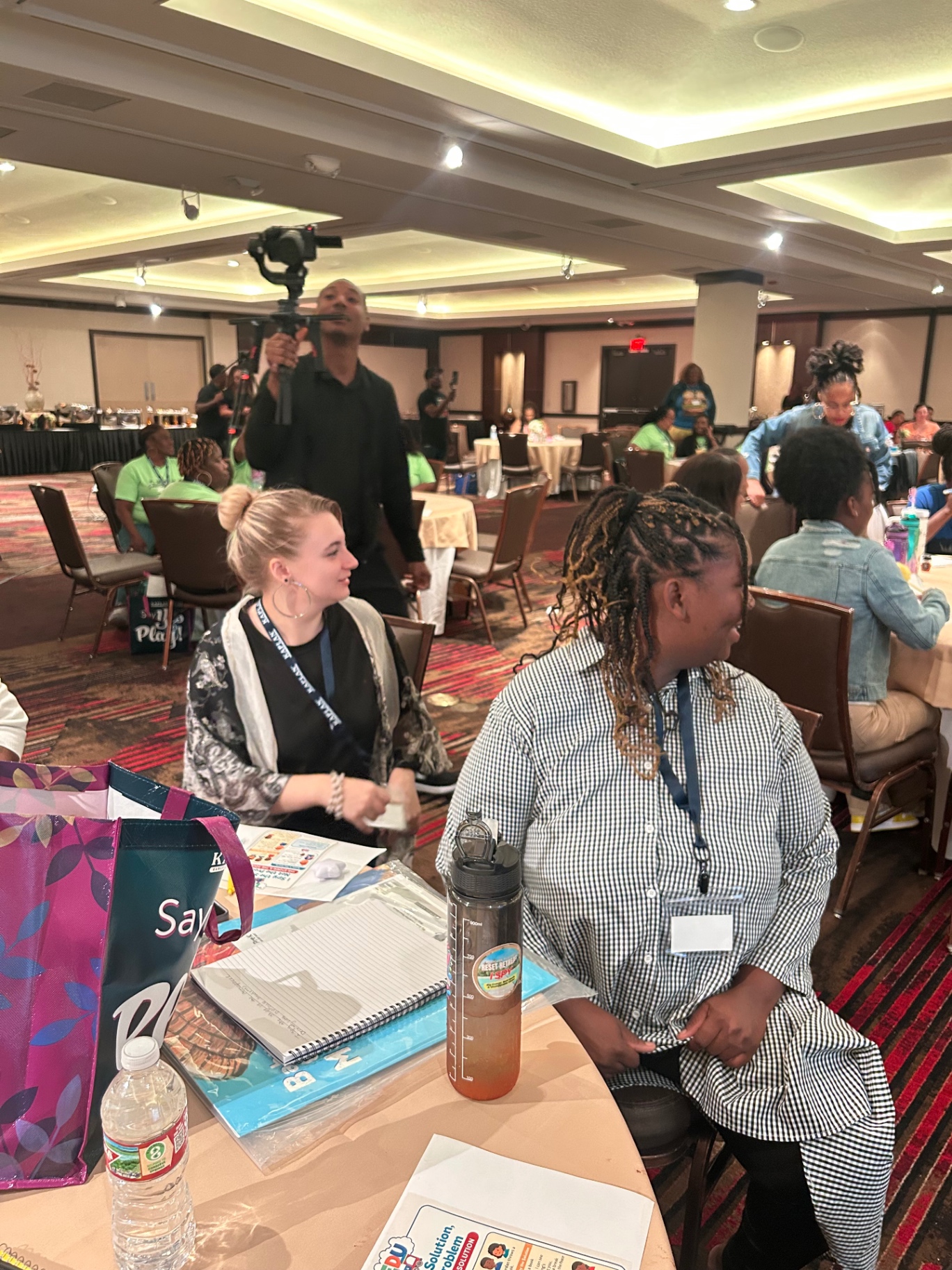 Staff seated together during a conference workshop session
