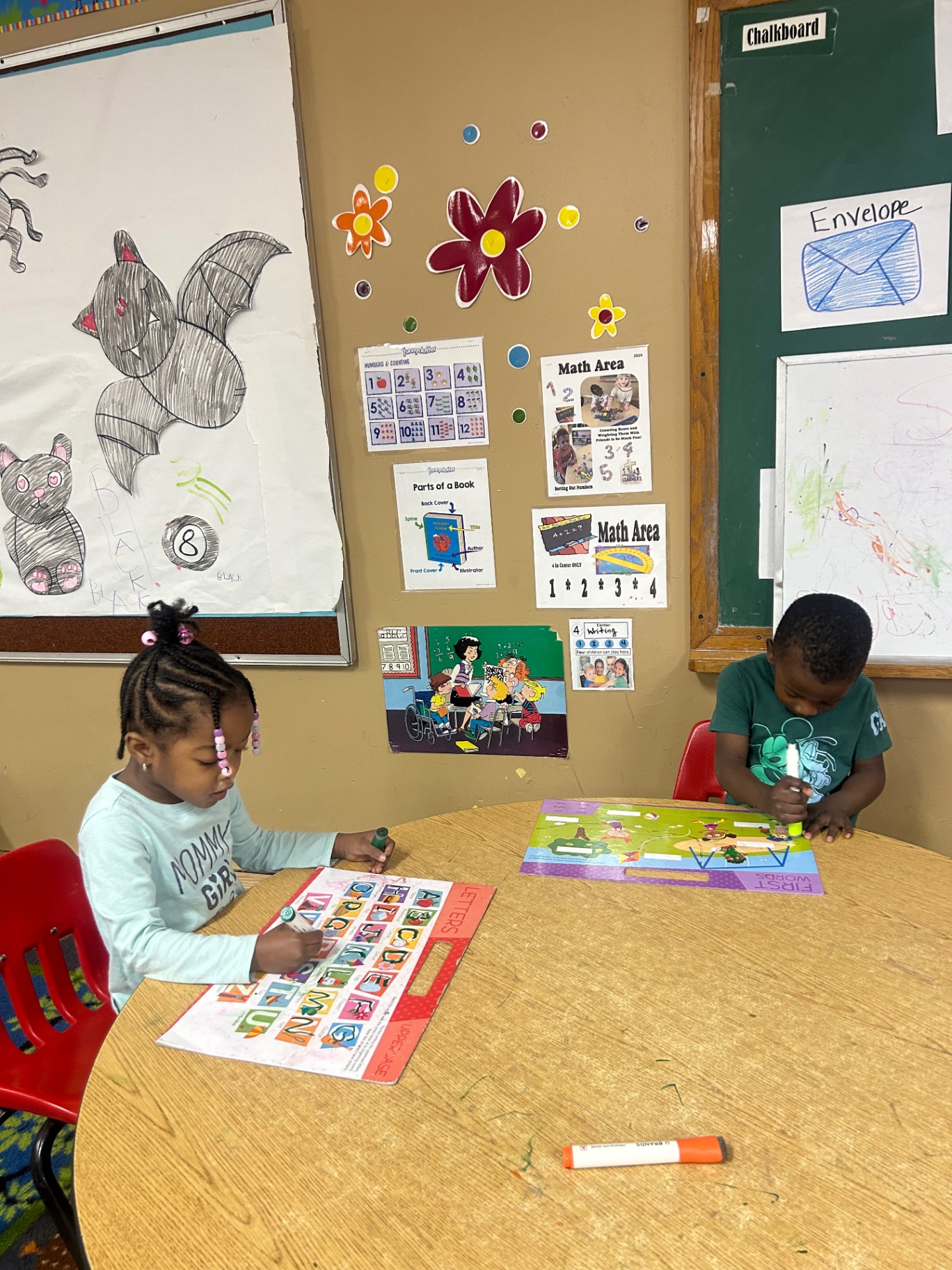 Preschoolers working at the learning table