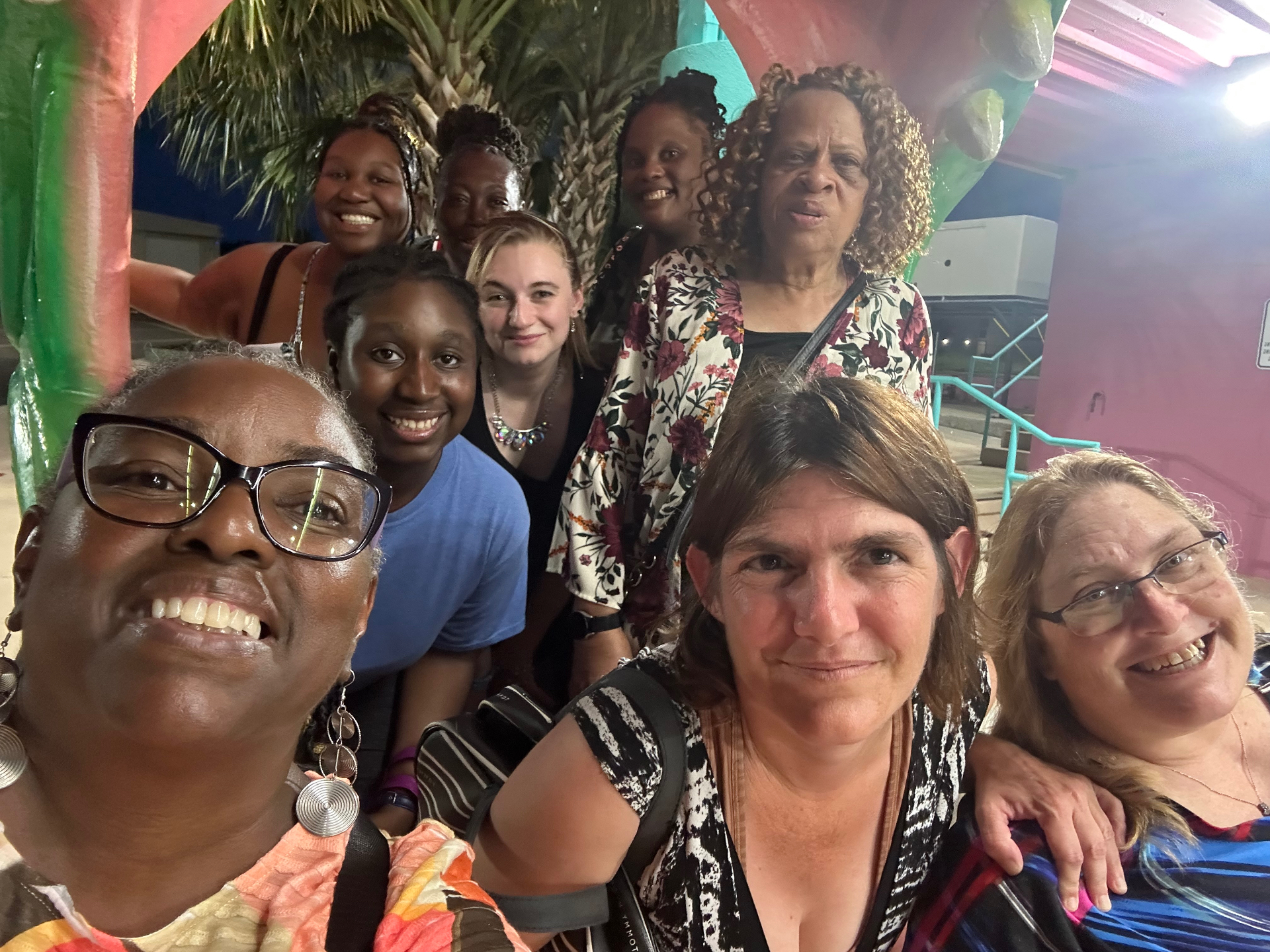 Staff group selfie during an evening team outing